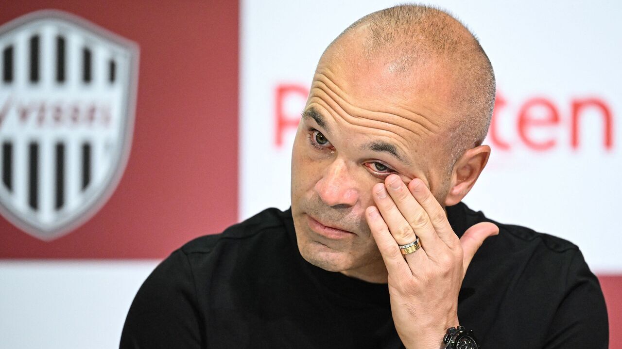 Spanish footballer Andres Iniesta, former Barcelona star and a present midfielder with Japanese club Vissel Kobe, reacts as he speaks during a press conference in Kobe on May 25, 2023.