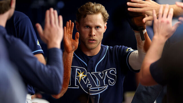 ST PETERSBURG, FLORIDA - MAY 25: Taylor Walls #6 of the Tampa Bay Rays is congratulated after scoring a run in the third inning during a game against the Toronto Blue Jays at Tropicana Field on May 25, 2023 in St Petersburg, Florida.