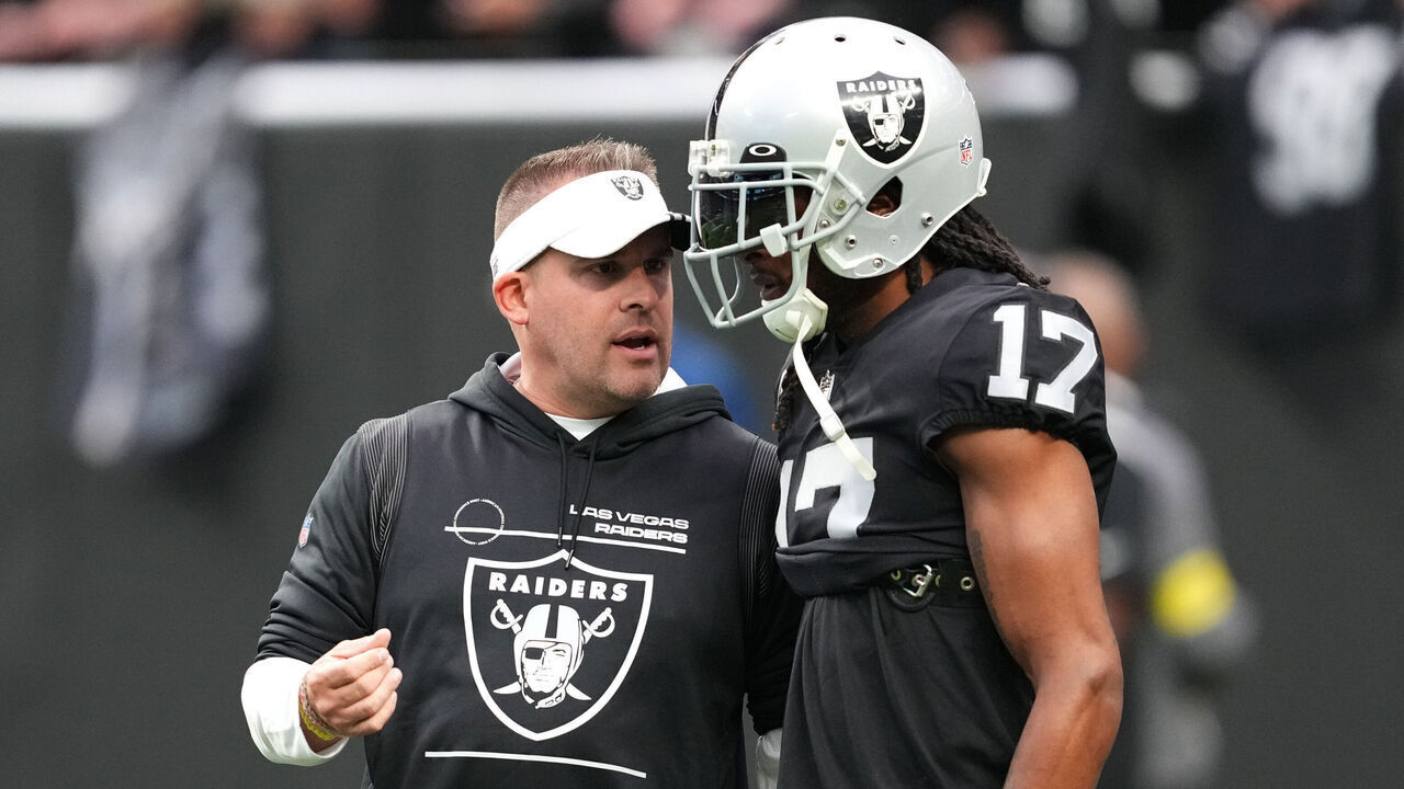 LAS VEGAS, NEVADA - DECEMBER 04: Head coach Josh McDaniels speaks to wide receiver Davante Adams #17 of the Las Vegas Raiders before a game against the Los Angeles Chargers at Allegiant Stadium on December 04, 2022 in Las Vegas, Nevada.