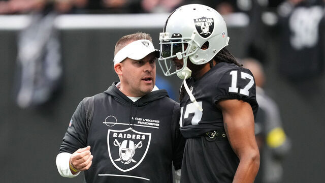 LAS VEGAS, NEVADA - DECEMBER 04: Head coach Josh McDaniels speaks to wide receiver Davante Adams #17 of the Las Vegas Raiders before a game against the Los Angeles Chargers at Allegiant Stadium on December 04, 2022 in Las Vegas, Nevada.