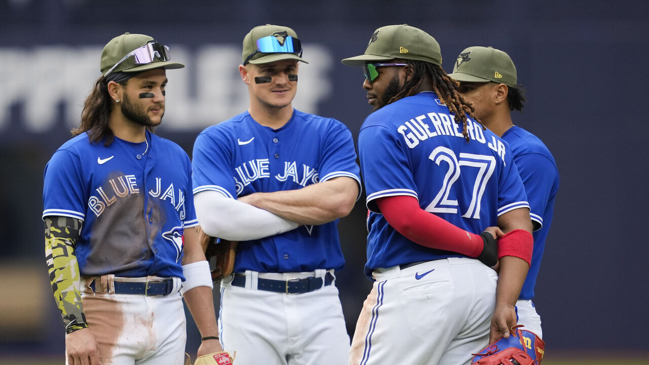 TORONTO, ON - MAY 20: Bo Bichette #11, Matt Chapman #26, Vladimir Guerrero #27 and Santiago Espinal #5 of the Toronto Blue Jays stand on the field in a break in play against the Baltimore Orioles during the sixth inning in their MLB game at the Rogers Centre on May 20, 2023 in Toronto, Ontario, Canada.