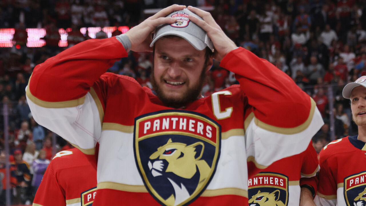 SUNRISE, FLORIDA - MAY 24: Aleksander Barkov #16 of the Florida Panthers puts on the conference championship hat after the game against the Carolina Hurricanes in Game Four of the Eastern Conference Finals of the 2023 Stanley Cup Playoffs at FLA Live Arena on May 24, 2023 in Sunrise, Florida. The Panthers defeated the Hurricanes 4-3 to take the series 4-0.
