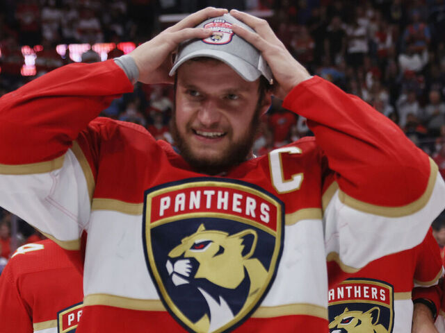 SUNRISE, FLORIDA - MAY 24: Aleksander Barkov #16 of the Florida Panthers puts on the conference championship hat after the game against the Carolina Hurricanes in Game Four of the Eastern Conference Finals of the 2023 Stanley Cup Playoffs at FLA Live Arena on May 24, 2023 in Sunrise, Florida. The Panthers defeated the Hurricanes 4-3 to take the series 4-0.