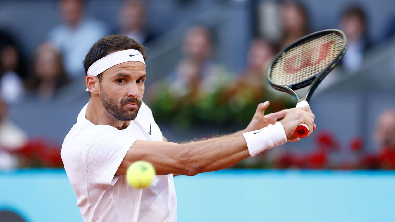 MADRID, SPAIN - APRIL 30: Grigor Dimitrov of Bulgaria in action against Carlos Alcaraz of Spain during the Mutua Madrid Open 2023 celebrated at Caja Magica on April 30, 2023 in Madrid, Spain.