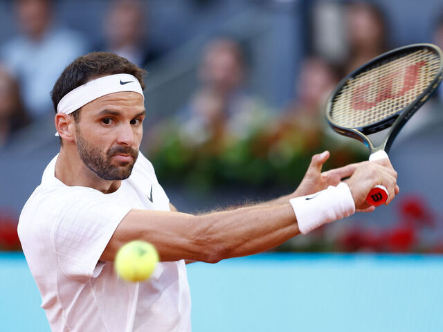 MADRID, SPAIN - APRIL 30: Grigor Dimitrov of Bulgaria in action against Carlos Alcaraz of Spain during the Mutua Madrid Open 2023 celebrated at Caja Magica on April 30, 2023 in Madrid, Spain.