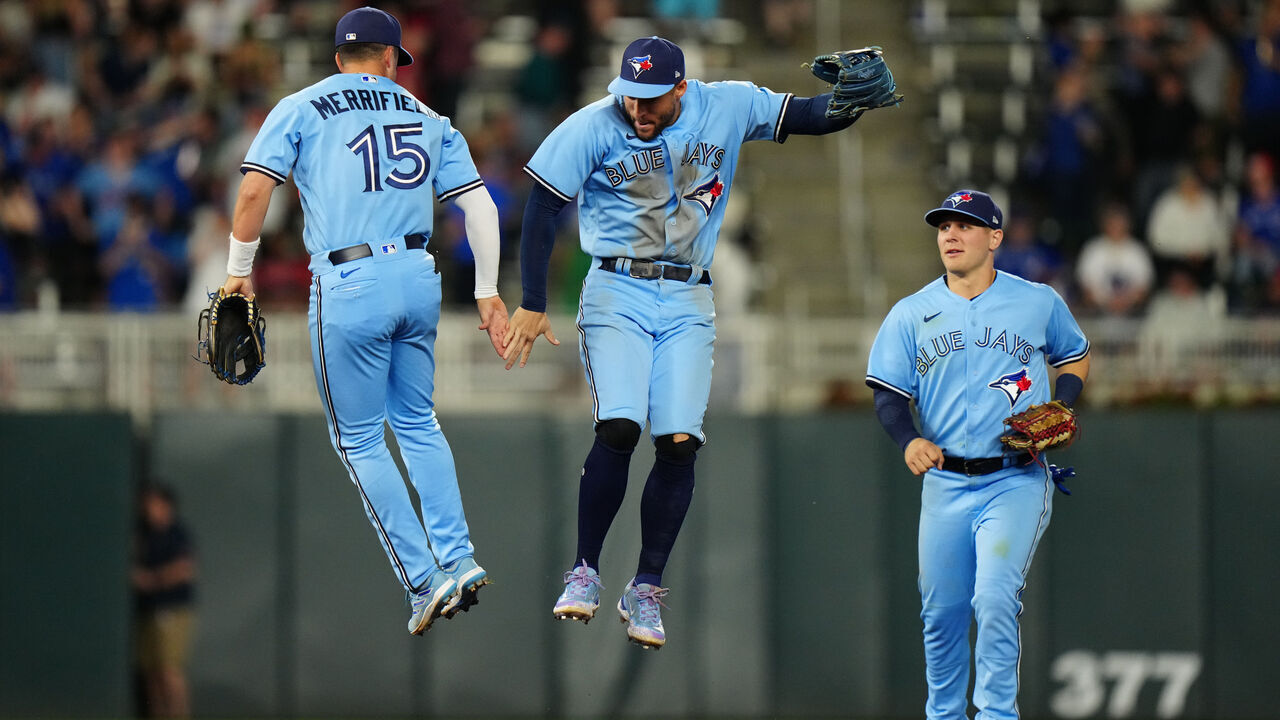 MINNEAPOLIS, MN - MAY 26: George Springer #4, Whit Merrifield #15 and Daulton Varsho #25 of the Toronto Blue Jays celebrate winning the game between the Toronto Blue Jays and the Minnesota Twins at Target Field on Friday, May 26, 2023 in Minneapolis, Minnesota.