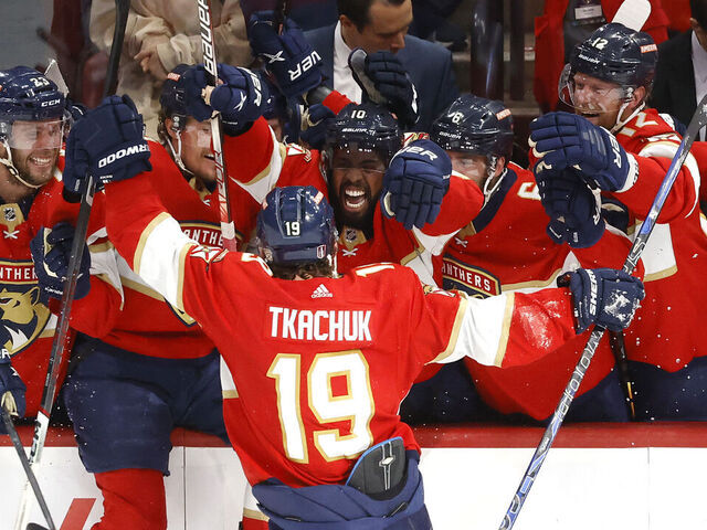 SUNRISE, FLORIDA - MAY 24: Matthew Tkachuk #19 of the Florida Panthers celebrates with his teammates after scoring the game winning goal on Frederik Andersen #31 of the Carolina Hurricanes during the third period in Game Four of the Eastern Conference Final of the 2023 Stanley Cup Playoffs at FLA Live Arena on May 24, 2023 in Sunrise, Florida.