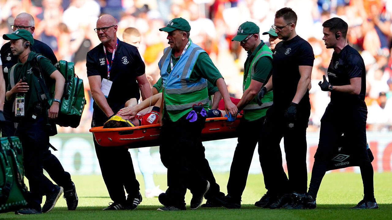 Luton Town's Tom Lockyer leaves the pitch on a stretcher after becoming injured during the Sky Bet Championship play-off final at Wembley Stadium, London. Picture date: Saturday May 27, 2023.