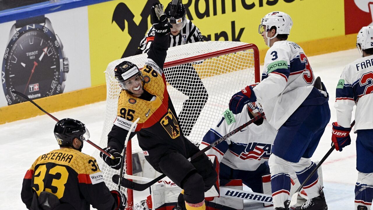 Germany's Frederik Tiffels (C/#95) celebrates scoring a goal during the 2023 IIHF Ice Hockey World Championships semi-final match between US and Germany in Tampere on May 27, 2023.