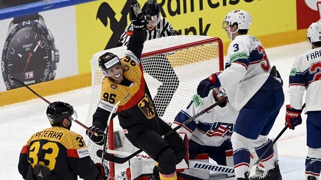 Germany's Frederik Tiffels (C/#95) celebrates scoring a goal during the 2023 IIHF Ice Hockey World Championships semi-final match between US and Germany in Tampere on May 27, 2023.