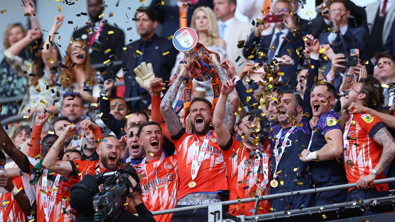 LONDON, ENGLAND - MAY 27: Sonny Bradley of Luton Town lifts the Sky Bet Championship Play Offs Final trophy following their team’s victory in the Sky Bet Championship Play-Off Final between Coventry City and Luton Town at Wembley Stadium on May 27, 2023 in London, England.
