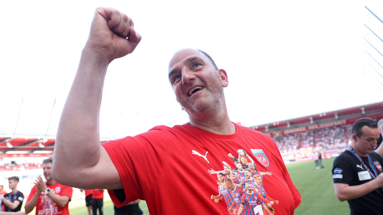 REGENSBURG, GERMANY - MAY 28: Frank Schmidt, Head Coach of 1. FC Heidenheim 1846, celebrates after the team's victory and promotion to the Bundesliga in the Second Bundesliga match between SSV Jahn Regensburg and 1. FC Heidenheim 1846 at Jahnstadion on May 28, 2023 in Regensburg, Germany.