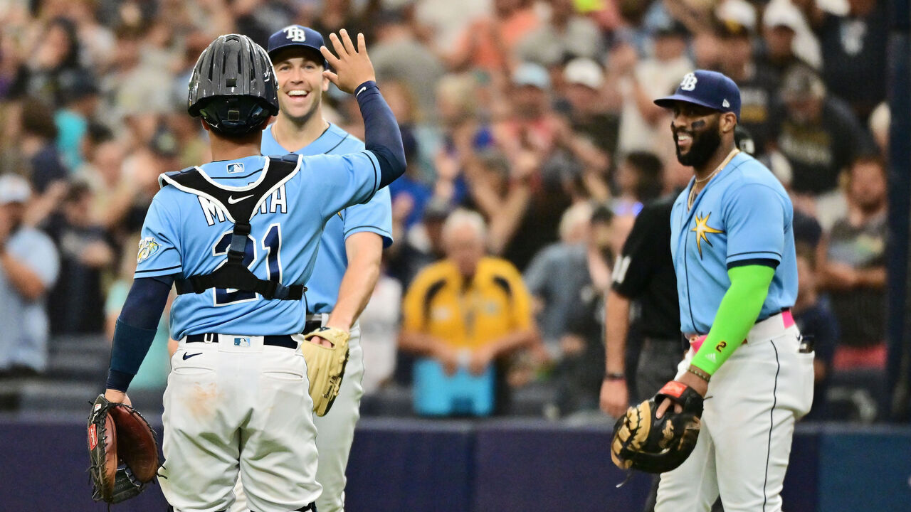 ST PETERSBURG, FLORIDA - MAY 28: Francisco Mejia #21 looks to high have Jason Adam #47 of the Tampa Bay Rays after defeating the Los Angeles Dodgers 11-10 at Tropicana Field on May 28, 2023 in St Petersburg, Florida.