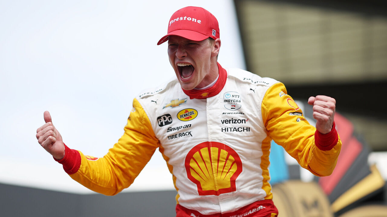 INDIANAPOLIS, INDIANA - MAY 28: Josef Newgarden, driver of the #2 PPG Team Penske Chevrolet, celebrates by pouring milk on his head after winning the 107th Running of Indianapolis 500 at Indianapolis Motor Speedway on May 28, 2023 in Indianapolis, Indiana.