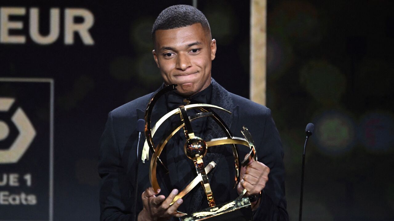 Paris Saint-Germain's French forward Kylian Mbappe reacts after receiving the Best Ligue 1 Player award during the 31th edition of the UNFP (French National Professional Football players Union) trophy ceremony, in Paris May 28, 2023.