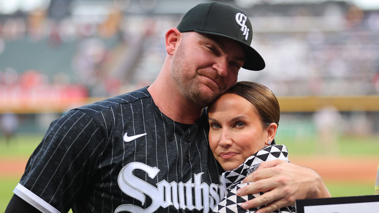 CHICAGO, ILLINOIS - MAY 29: Liam Hendriks #31 of the Chicago White Sox hugs his wife, Kristi Hendriks, prior to the game against the Los Angeles Angels at Guaranteed Rate Field on May 29, 2023 in Chicago, Illinois.