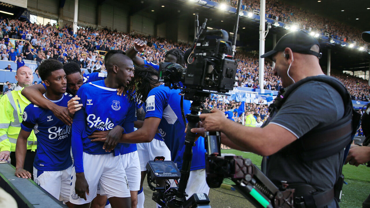 LIVERPOOL, ENGLAND - MAY 28: Abdoulaye Doucoure of Everton is mobbed by teammates are filmed by a television Steadicam camera as he celebrates after scoring their 1st goal during the Premier League match between Everton FC and AFC Bournemouth at Goodison Park on May 28, 2023 in Liverpool, England.
