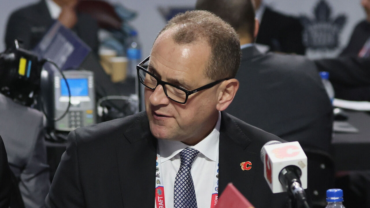 MONTREAL, QUEBEC - JULY 08: (L-R) Don Maloney, Brad Treliving and Tod Button of the Calgary Flames attend the 2022 NHL Draft at the Bell Centre on July 08, 2022 in Montreal, Quebec.
