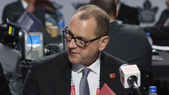 MONTREAL, QUEBEC - JULY 08: (L-R) Don Maloney, Brad Treliving and Tod Button of the Calgary Flames attend the 2022 NHL Draft at the Bell Centre on July 08, 2022 in Montreal, Quebec.