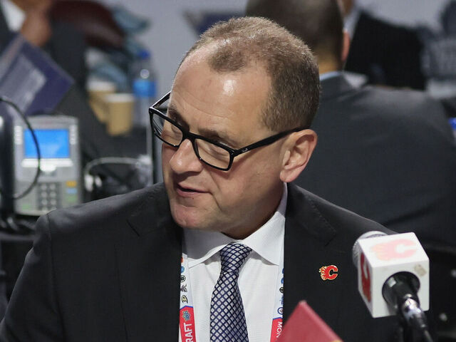 MONTREAL, QUEBEC - JULY 08: (L-R) Don Maloney, Brad Treliving and Tod Button of the Calgary Flames attend the 2022 NHL Draft at the Bell Centre on July 08, 2022 in Montreal, Quebec.
