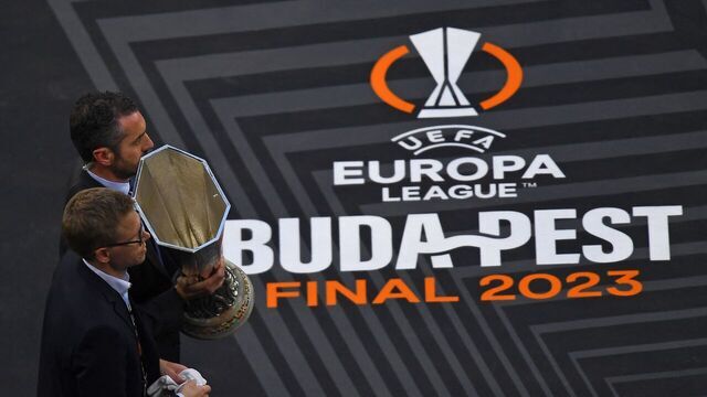The Europa League trophy is brought out ahead of the UEFA Europa League final football match between Sevilla FC and AS Roma at the Puskas Arena in Budapest on May 31, 2023.