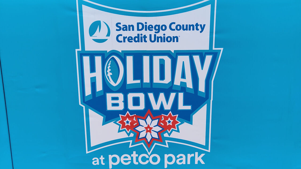 SAN DIEGO, CA - DECEMBER 28: The Holiday Bowl logo in an empty stadium prior to the canceled SDCCU Holiday Bowl between the UCLA Bruins and the San Diego State Aztecs on December 28, 2021, at Petco Park in San Diego, CA. UCLA had to withdraw due to COVID-19 protocols and the game was subsequently canceled.