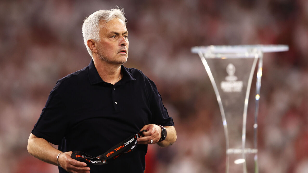 BUDAPEST, HUNGARY - MAY 31: Jose Mourinho, Head Coach of AS Roma, removes their runners up medal after collecting it from Aleksander Ceferin, President of UEFA, (not pictured) after defeat to Sevilla FC in the penalty shoot out during the UEFA Europa League 2022/23 final match between Sevilla FC and AS Roma at Puskas Arena on May 31, 2023 in Budapest, Hungary.