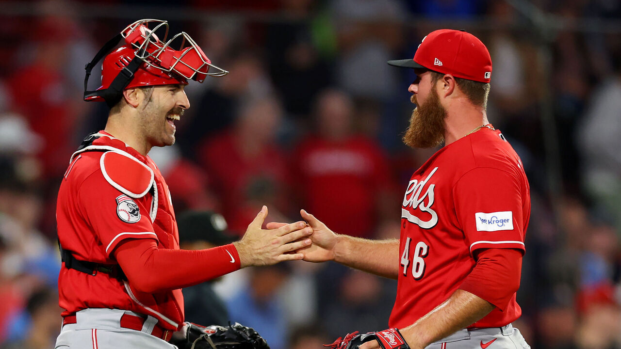 BOSTON, MASSACHUSETTS - MAY 31: Buck Farmer #46 of the Cincinnati Reds celebrates with Luke Maile #22 after the Reds defeat the Boston Red Sox 5-4 at Fenway Park on May 31, 2023 in Boston, Massachusetts.