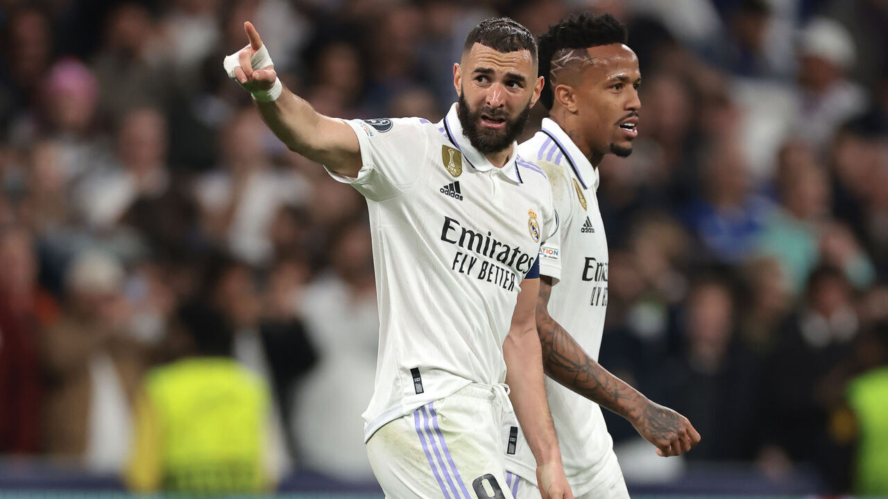 MADRID, SPAIN - MARCH 15: Karim Benzema of Real Madrid gestures towards the fans as he celebrates after scoring to give the side a 1-0 lead during the UEFA Champions League round of 16 leg two match between Real Madrid and Liverpool FC at Estadio Santiago Bernabeu on March 15, 2023 in Madrid, Spain.