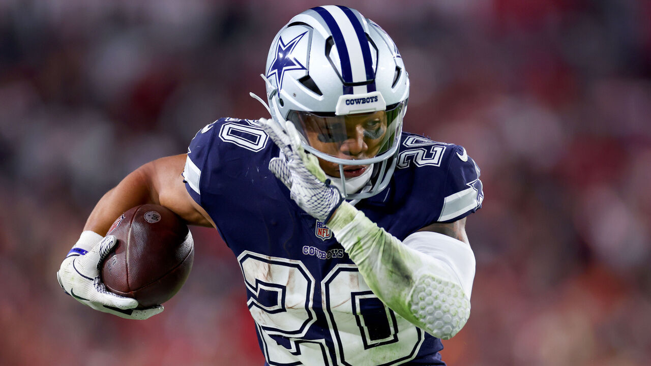TAMPA, FLORIDA - JANUARY 16: Tony Pollard #20 of the Dallas Cowboys carries the ball against the Tampa Bay Buccaneers during the third quarter in the NFC Wild Card playoff game at Raymond James Stadium on January 16, 2023 in Tampa, Florida.