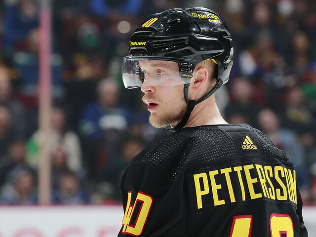 VANCOUVER, CANADA - APRIL 8: Elias Pettersson #40 of the Vancouver Canucks looks up ice during their NHL game against the Calgary Flames at Rogers Arena April 8, 2023 in Vancouver, British Columbia, Canada.