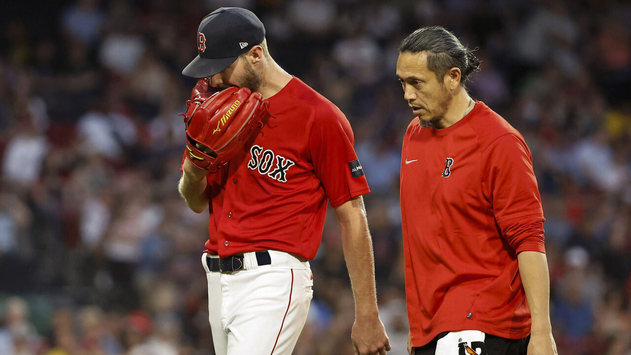 BOSTON, MA - JUNE 1: Chris Sale #41 of the Boston Red Sox bites on his glove as he leaves the game in the middle of the fourth inning against the Cincinnati Reds at Fenway Park on June 1, 2023 in Boston, Massachusetts.