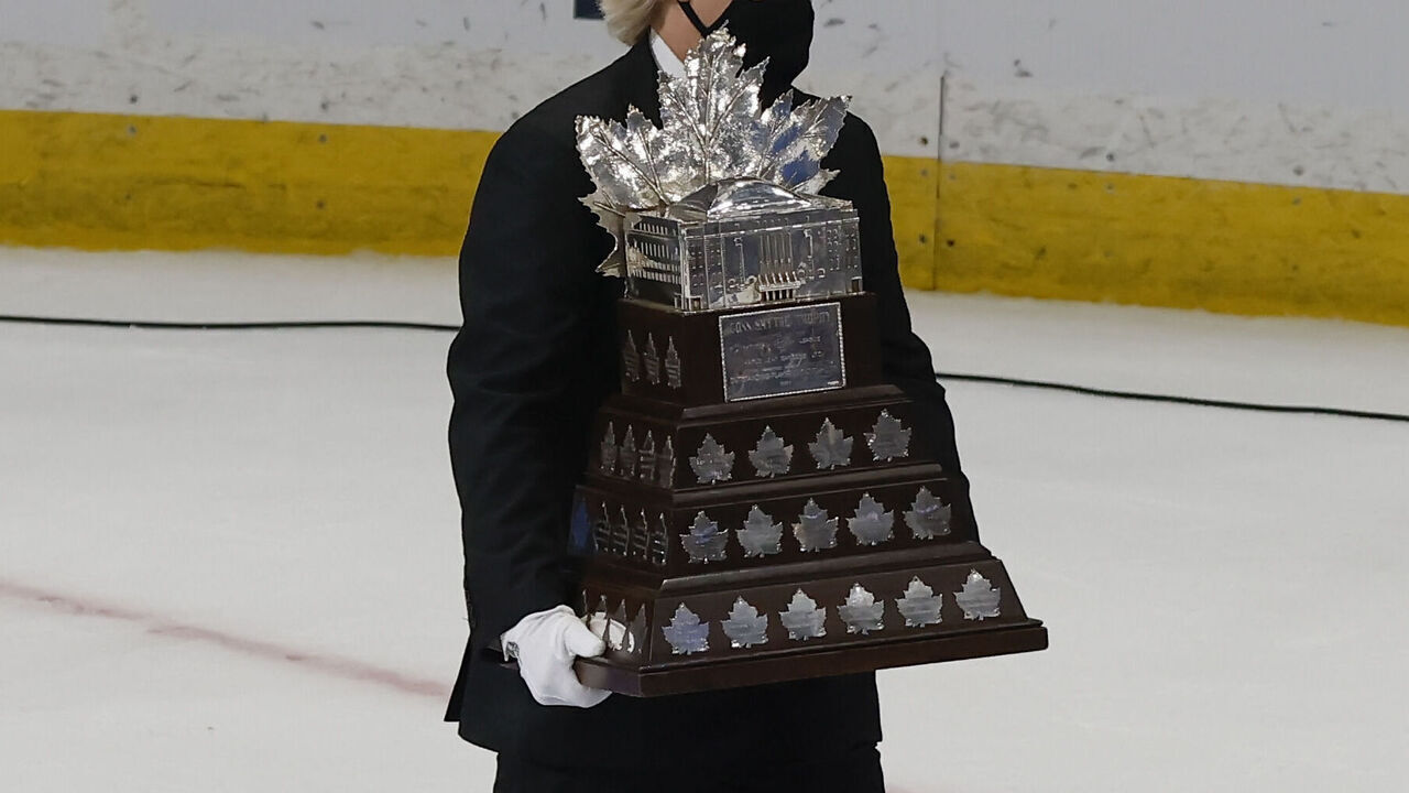 TAMPA, FL - JULY 07: The Conn SMythe Trophy is carried out on the ice by a handler during Game Five of the 2021 Stanley Cup Final between the Montreal Canadiens and the Tampa Bay Lightning on July 7, 2021 at Amalie Arena in Tampa, Fl.