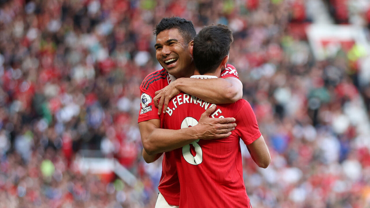 MANCHESTER, ENGLAND - MAY 28: Bruno Fernandes of Manchester United celebrates with teammate Casemiro after scoring the team's first goal during the Premier League match between Manchester United and Fulham FC at Old Trafford on May 28, 2023 in Manchester, England.