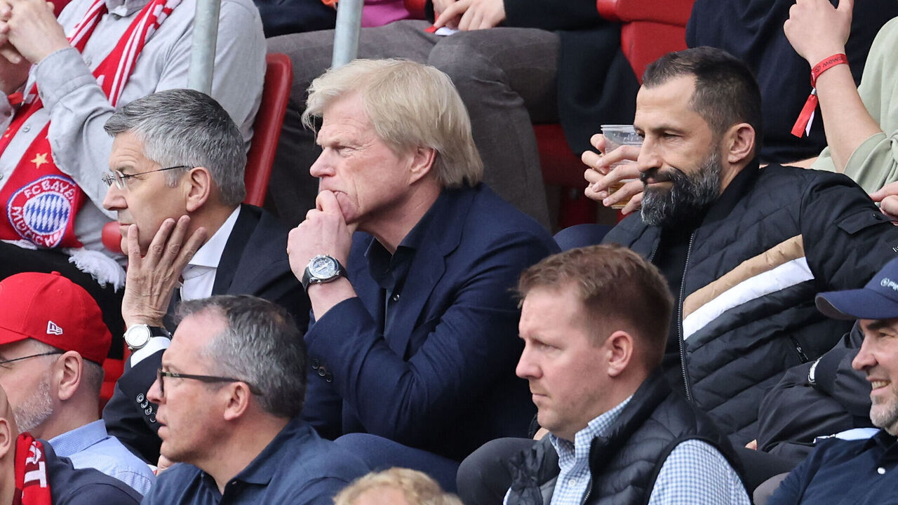 (L-R) Bayern Munich's President Herbert Hainer, Bayern Munich's CEO Oliver Kahn and Bayern Munich's Bosnian sporting director Hasan Salihamidzic follows the action from the stands during the German first division Bundesliga football match between Mainz 05 and FC Bayern Munich in Mainz on April 22, 2023.