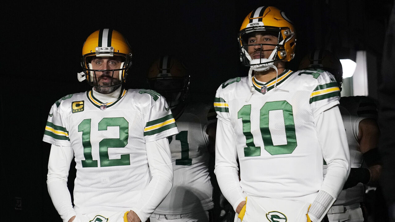 GREEN BAY, WISCONSIN - NOVEMBER 17: Aaron Rodgers #12 and Jordan Love #10 of the Green Bay Packers walk onto the field prior to the game against the Tennessee Titans at Lambeau Field on November 17, 2022 in Green Bay, Wisconsin.