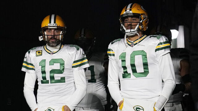 GREEN BAY, WISCONSIN - NOVEMBER 17: Aaron Rodgers #12 and Jordan Love #10 of the Green Bay Packers walk onto the field prior to the game against the Tennessee Titans at Lambeau Field on November 17, 2022 in Green Bay, Wisconsin.