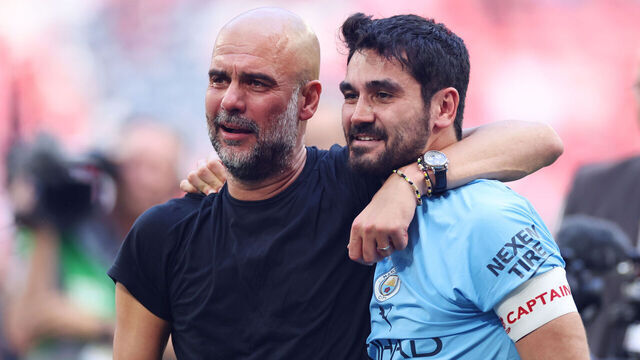 LONDON, ENGLAND - JUNE 3: Manchester City manager Josep Guardiola congratulates Manchester City's Ilkay Gundogan after winning the Emirates FA Cup Final match between Manchester City and Manchester United at Wembley Stadium on June 3, 2023 in London, England.