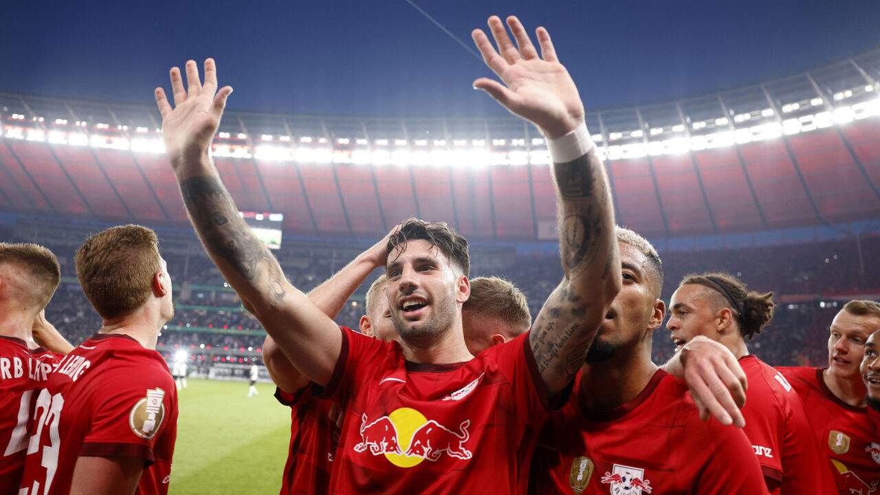Leipzig's Hungarian midfielder Dominik Szoboszlai (C) celebrates with teammates after scoring the 2-0 goal during the German Cup (DFB Pokal) final football match RB Leipzig v Eintracht Frankfurt in Berlin, Germany, on June 3, 2023.