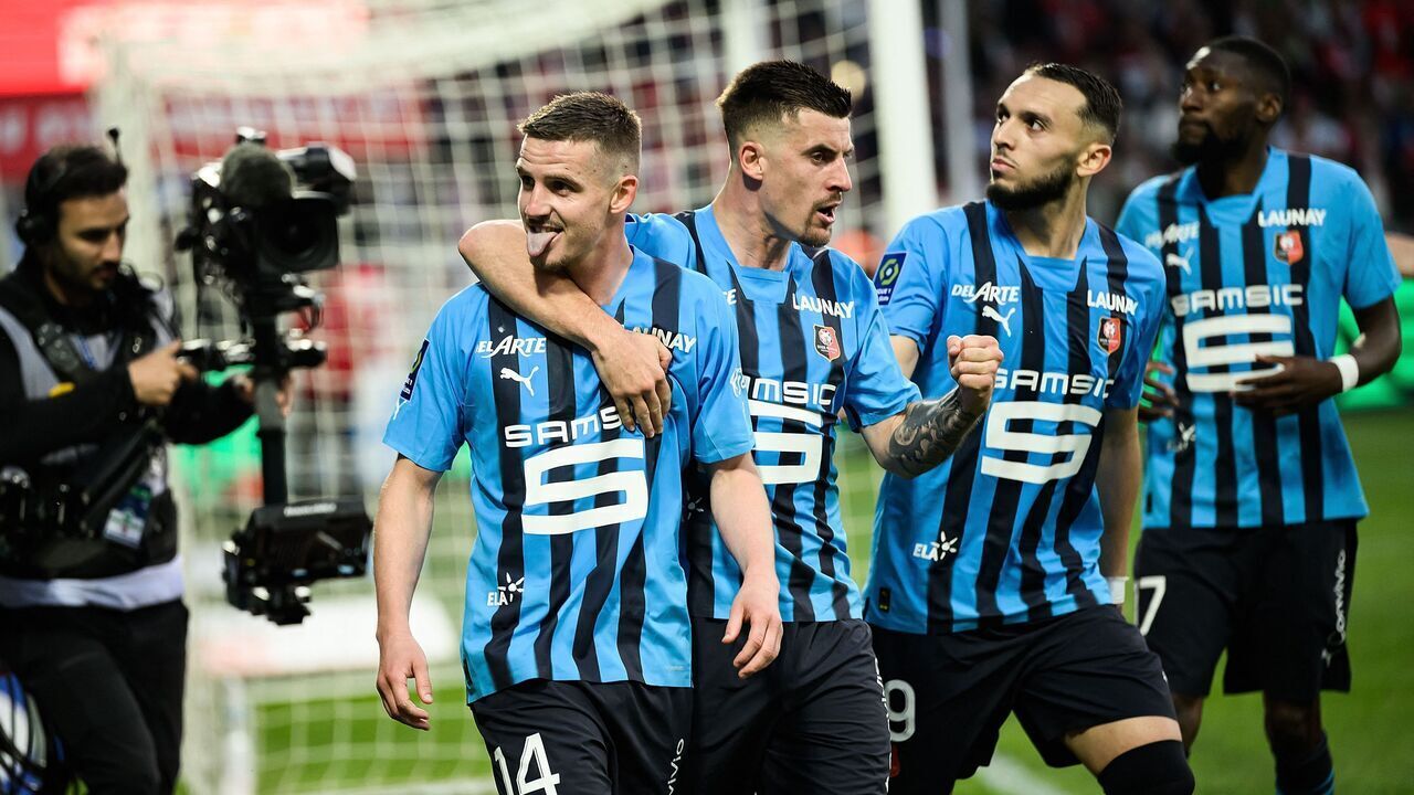 Rennes' French midfielder Benjamin Bourigeaud (L) celebrates after scoring a second goal for his team during the French L1 football match between Stade Brestois 29 (Brest) and Stade Rennais FC at Stade Francis-Le Ble in Brest, western France on June 3, 2023.
