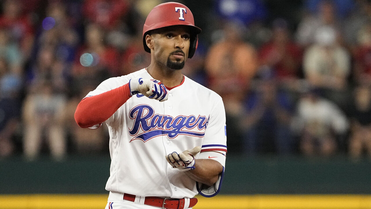 ARLINGTON, TEXAS - JUNE 03: Marcus Semien #2 of the Texas Rangers gestures towards his dugout after hitting a double during the first inning against the Seattle Mariners at Globe Life Field on June 03, 2023 in Arlington, Texas.