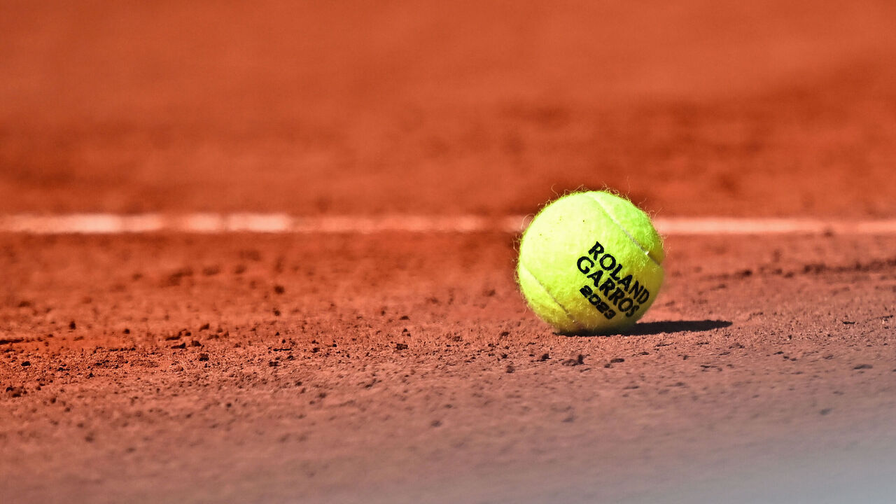 A Roland Garros 2023 official tennis ball sits on the court during a men's singles match on day seven of the Roland-Garros Open tennis tournament at the Court Simonne-Mathieu in Paris on June 3, 2023.