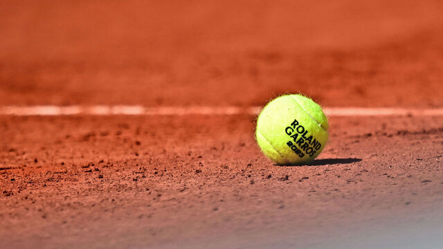 A Roland Garros 2023 official tennis ball sits on the court during a men's singles match on day seven of the Roland-Garros Open tennis tournament at the Court Simonne-Mathieu in Paris on June 3, 2023.