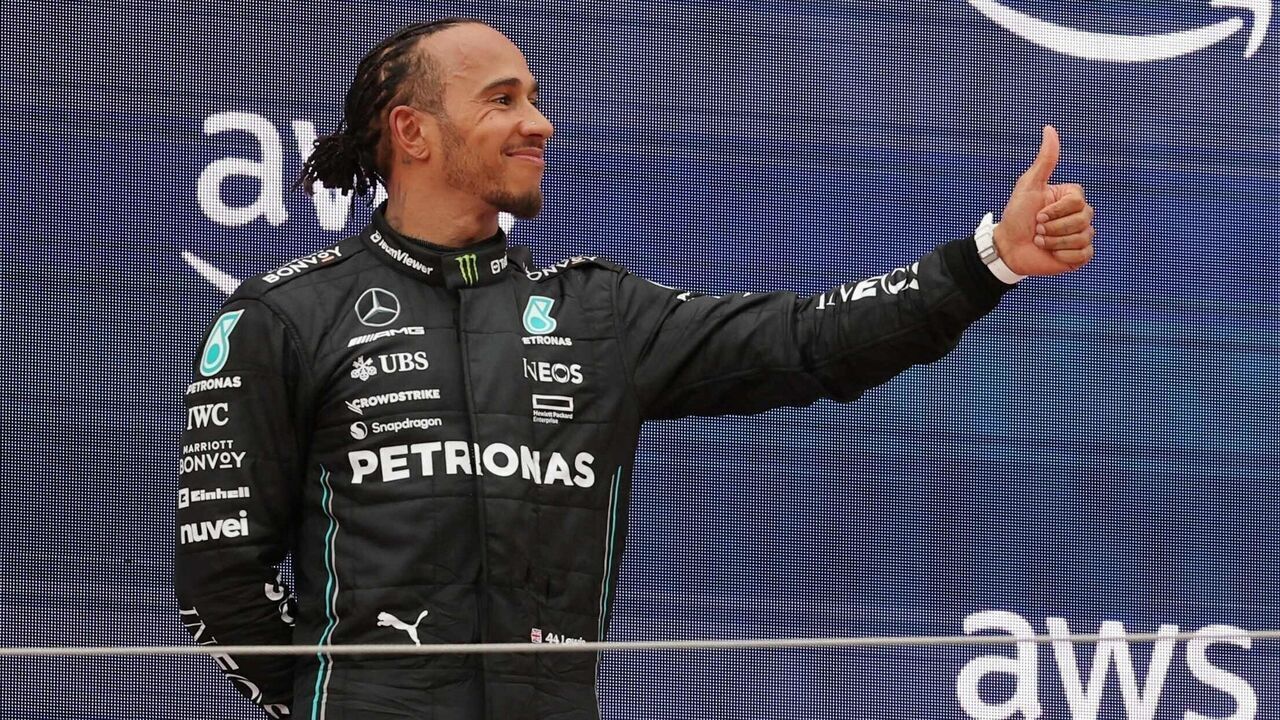 Mercedes' British driver Lewis Hamilton (L), Red Bull's Dutch driver Max Verstappen (C) and Mercedes' British driver George Russell celebrate on the podium after the Spanish Formula One Grand Prix race at the Circuit de Catalunya on June 4, 2023 in Montmelo, on the outskirts of Barcelona.