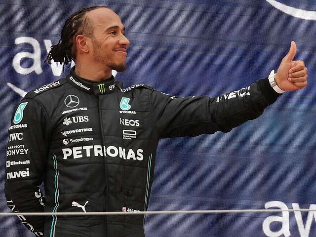 Mercedes' British driver Lewis Hamilton (L), Red Bull's Dutch driver Max Verstappen (C) and Mercedes' British driver George Russell celebrate on the podium after the Spanish Formula One Grand Prix race at the Circuit de Catalunya on June 4, 2023 in Montmelo, on the outskirts of Barcelona.
