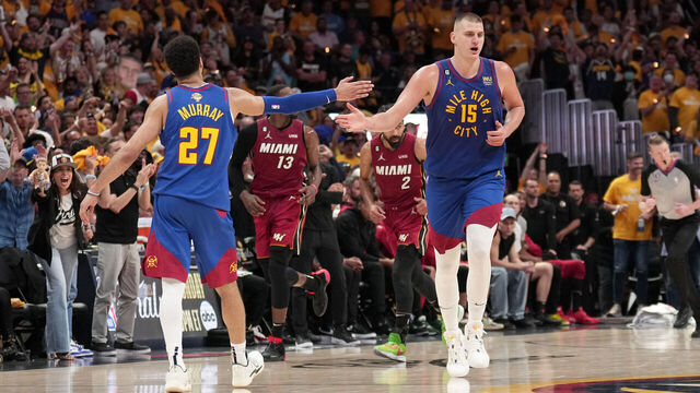 DENVER, CO - JUNE 1: Nikola Jokic #15 of the Denver Nuggets high fives Jamal Murray #27 of the Denver Nuggets during Game One of the 2023 NBA Finals against the Miami Heat on June 1, 2023 at the Ball Arena in Denver, Colorado. NOTE TO USER: User expressly acknowledges and agrees that, by downloading and/or using this Photograph, user is consenting to the terms and conditions of the Getty Images License Agreement. Mandatory Copyright Notice: Copyright 2023 NBAE