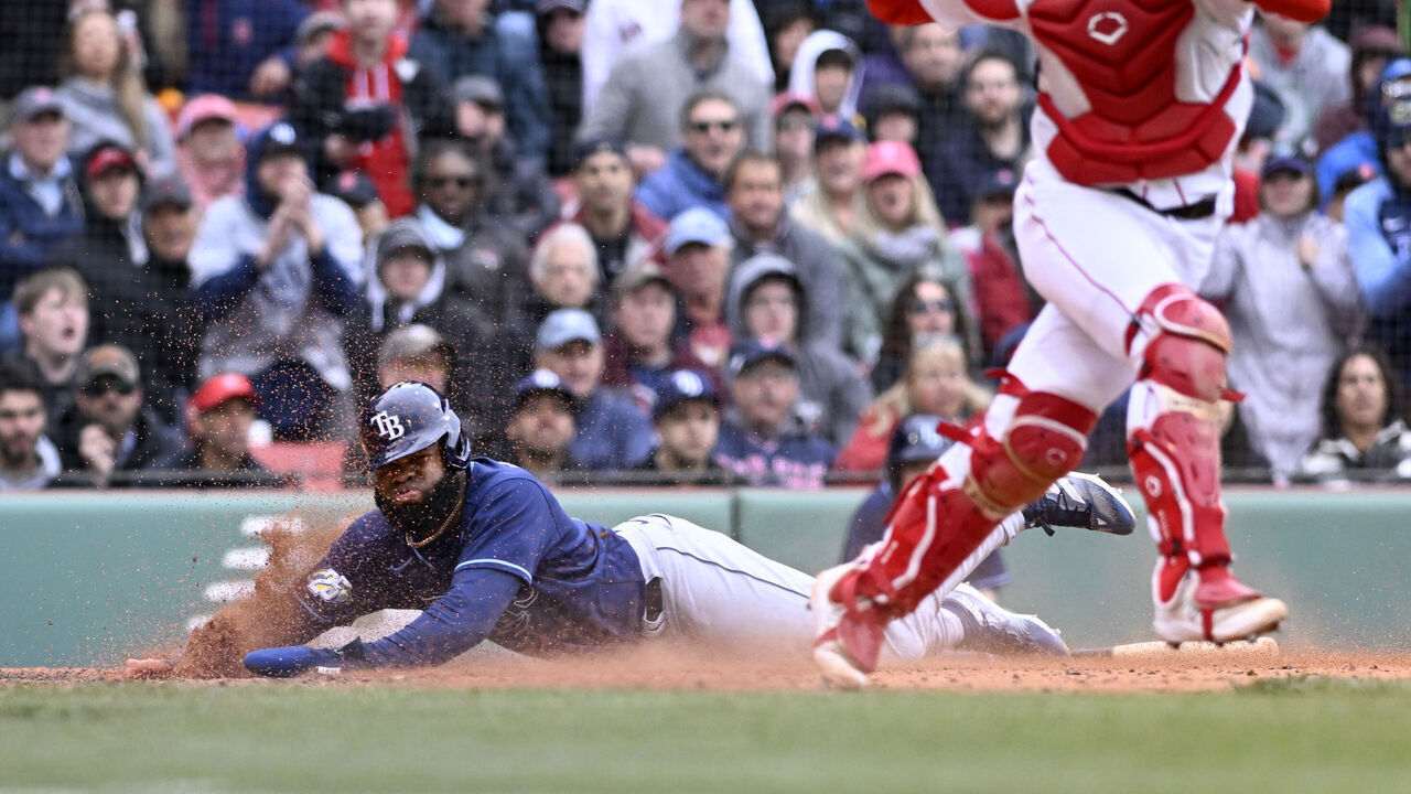 BOSTON, MASSACHUSETTS - JUNE 04: Manuel Margot #13 of the Tampa Bay Rays scores in the six inning against the Boston Red Sox at Fenway Park on June 04, 2023 in Boston, Massachusetts.