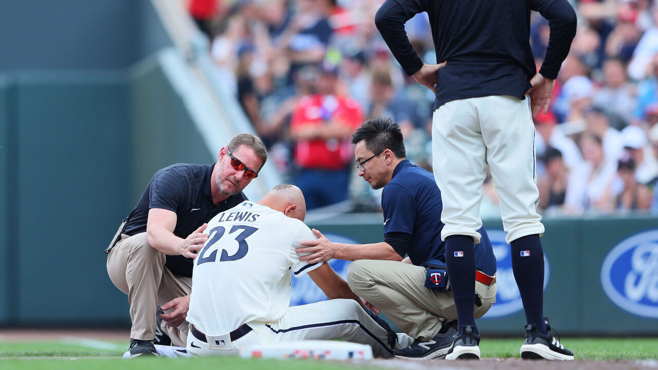 MINNEAPOLIS, MN - JUNE 4: Royce Lewis #23 of the Minnesota Twins gets checked out by medical staff after colliding and flipping over Gabriel Arias #13 of the Cleveland Guardians in the eighth inning at Target Field on June 4, 2023 in Minneapolis, Minnesota.