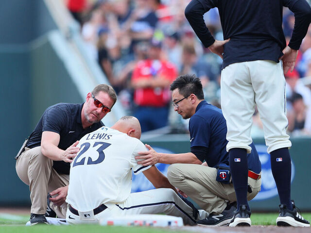 MINNEAPOLIS, MN - JUNE 4: Royce Lewis #23 of the Minnesota Twins gets checked out by medical staff after colliding and flipping over Gabriel Arias #13 of the Cleveland Guardians in the eighth inning at Target Field on June 4, 2023 in Minneapolis, Minnesota.