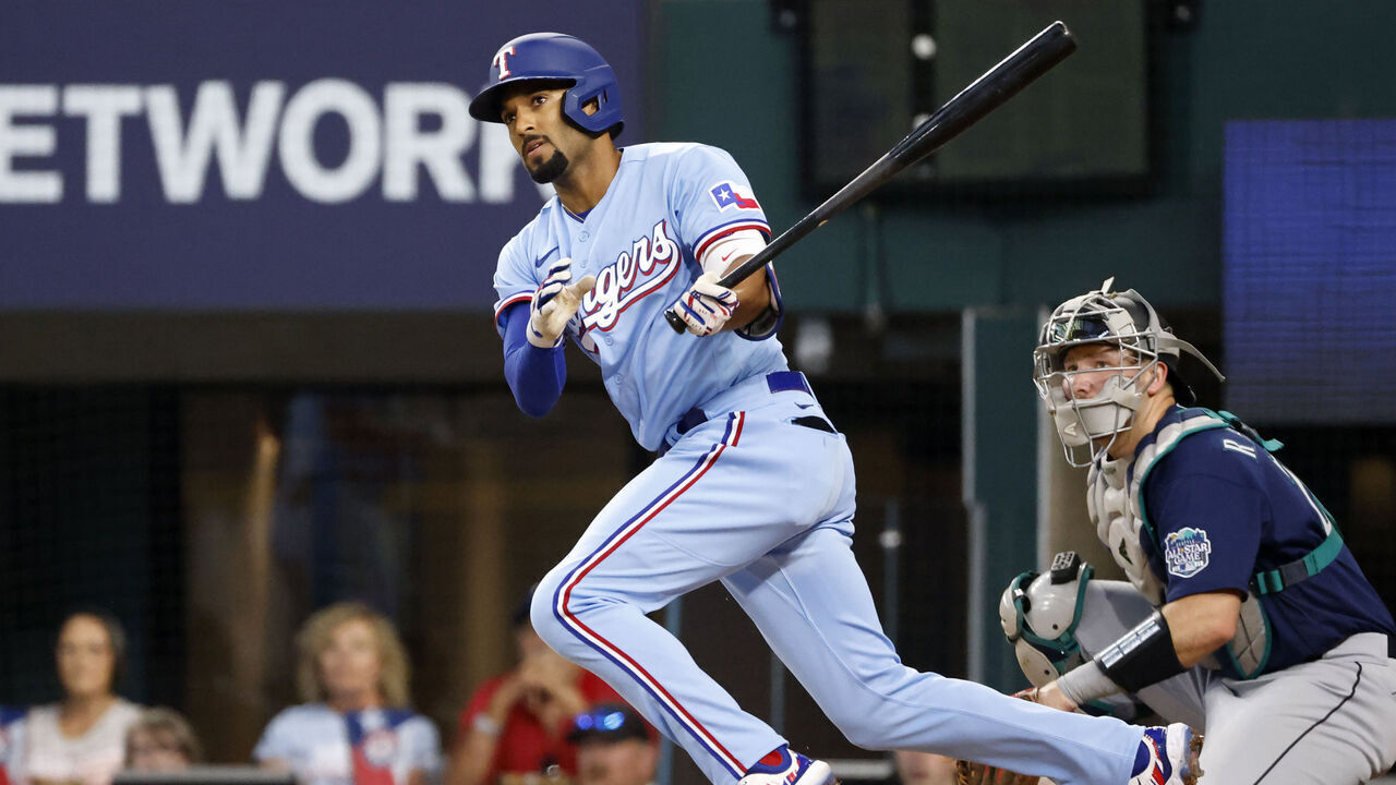 ARLINGTON, TX - JUNE 4: Marcus Semien #2 of the Texas Rangers doubles against the Seattle Mariners during the first inning at Globe Life Field on June 4, 2023 in Arlington, Texas.